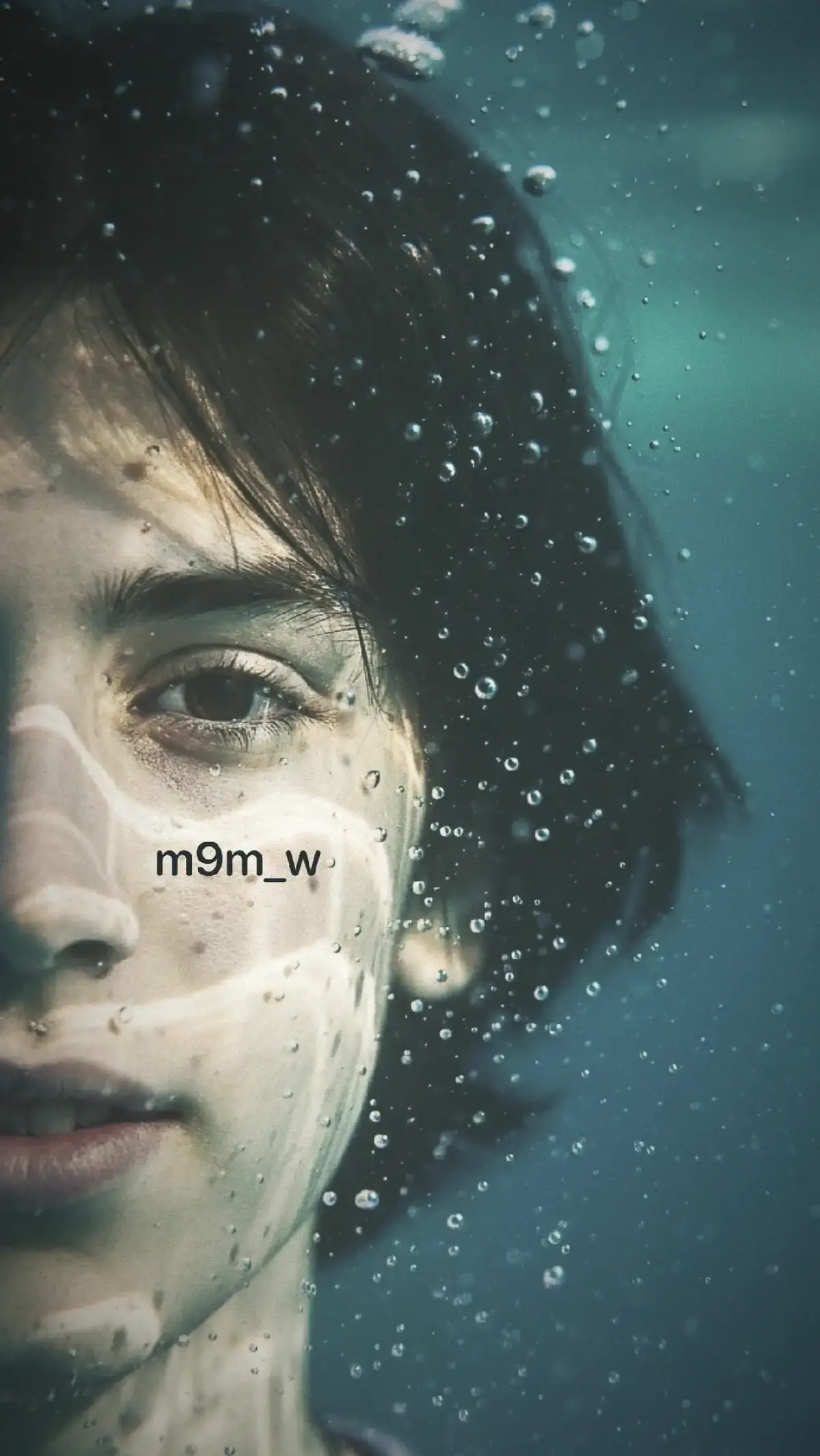 Agua close up Ultra-detailed hyper-realistic close-up portrait of the person from the reference photo, preserving all unique facial features. Only the left half of the face is shown, submerged underwater, with one eye in sharp focus placed at the far left of the frame. Light rays create dynamic caustic patterns across the skin. Suspended water droplets and tiny bubbles add depth and realism. Cinematic underwater lighting with soft shadows and      crisp highlights. #ال_محمد #اهل_البيت_عليهم_سلام #اللهم_صل_على_محمد_وآل_محمد #اباعبدالله_الحسين_ع #امير_المؤمنين 
