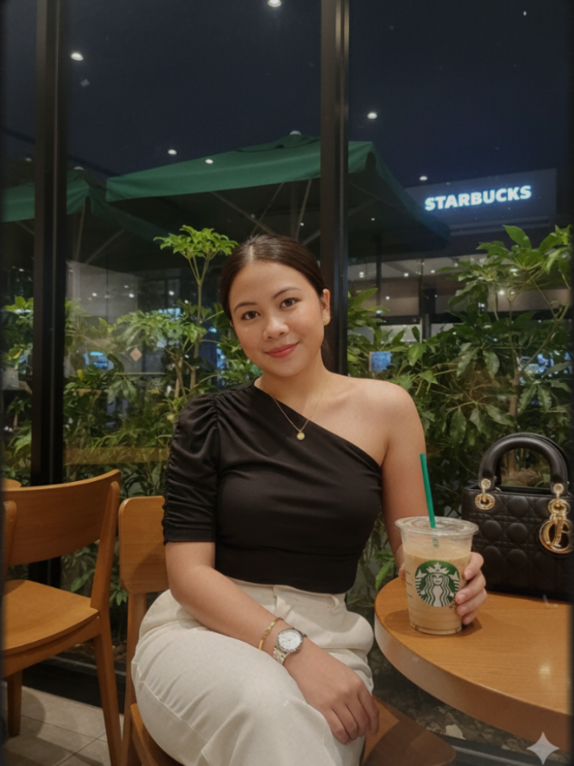Gemini AI Starbucks ✨❤A portrait photo of a beautiful young Filipina woman and ruched one-shouler black top and white pants and sitting on a Starbucks chair cafe . She is 27 years old, with fair skin, height 156cm,weight 59kg, oval shaped face,with pointed chin, and slim curve body. She posed and smiling softly while Starbucks with a straw with a black Dior bag on the dining table and gold accessories necklace & earrings and bracelet. The setting features Starbucks coffee with a starbucks roof, tropical cafe, and warm natural midnight. The atmosphere is relaxed, natural, and tropical with clear night skies and soft shadows.and a watch on her wrist, creating a casual and stylish vacation vibe, another pose, Don't change the face.