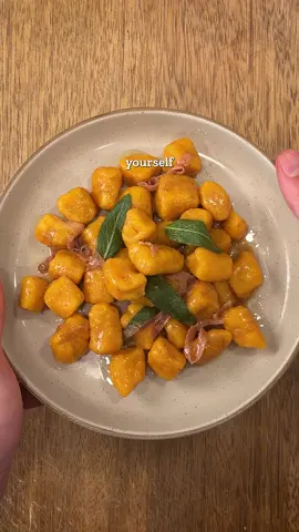 Michelin Meals You'll Actually Make Ep. 1 | Butternut Squash Gnocchi with Sage & Prosciutto  From @stefano_secchi & @michelinguide , adapted by me Ingredients (2–3 servings) For the gnocchi: 	•	1 cup butternut squash purée* 	•	~1 cup all-purpose flour (may need more or less) 	•	¼ teaspoon pumpkin pie spice or nutmeg 	•	Semolina or AP flour (for dusting) *Roast cubed butternut squash at 350°F (175°C) until very soft, then blend until smooth. If watery, strain through cheesecloth before using. For the sauce: 	•	2–3 tablespoons unsalted butter 	•	4–5 sage leaves 	•	1 slice prosciutto, thinly sliced 	•	Grated Parmesan, to finish Method 	1.	Make the dough: In a large bowl, add flour, squash purée, and spice. Mix together until combined. If the dough comes together with flour left in the bowl, that’s fine. If it’s sticky, add a little more flour. Knead briefly until you have a soft, smooth dough ball. 	2.	Shape the gnocchi: Roll into ½-inch ropes (“snakes”) on a floured surface. Cut into bite-sized pieces with a bench scraper. Roll each piece over the back of a fork to make ridges. Place on a tray dusted with semolina so they don’t stick. (At this stage you can freeze them for later.) 	3.	Cook the gnocchi: Bring salted water to a boil. Add gnocchi and cook until they float, about 3 minutes. Reserve 1 cup pasta water. 	4.	Make the sauce: In a skillet over medium heat, melt butter until lightly browned and nutty. Add sage leaves and prosciutto, cooking just ~30 seconds until fragrant. 	5.	Combine: Add cooked gnocchi straight to the pan with a splash of pasta water. Toss vigorously for ~15 seconds to coat. 	6.	Finish: Serve hot with grated Parmesan.