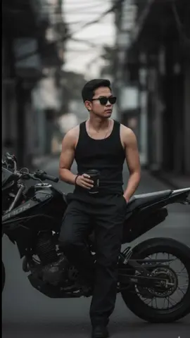 Gemini AI PROMPT: 1. Open Gemini App/Website 2. Upload Your Photo 3. Copy & Paste this prompt: Create image that the subject is wearing black baggy pants, black sando revealing the musculinity, black shoes, wear sunglasses, sit standing on the side of the motorcycle, legs crossed, with a mysterious look beside the black supermoto motorcycle but the face should be similar, and hands holding a black cup of take-away. Manly and edgy style with a mysterious feel, dim. Make it hyper realistic. #gemini #prompt #aesthetic #photography #ai