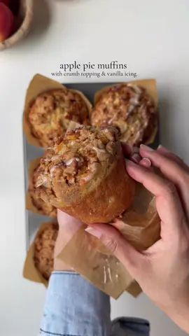 Apple pie muffins  Ingredients  4 tbsp (55g) unsalted butter, melted  3/4 cup (180g)  granulated sugar  1/2 light (100g) brown sugar  2 tsp (10g) baking powder 1/2 tsp baking soda 1 tbsp vanilla bean paste 2 eggs , room temp Pinch of salt  2 1/2 cups (312g)  all purpose flour  1 cup apple, peeled and diced 1/4 cup (60g) sour cream, room temp 1 cup butter milk room temp 4 tbsp neutral oil 1 tsp cinnamon  For Caramelized apple ( topping )  1 cup apples, peeled and diced into small cubes  2 tbsp unsalted butter  2 tbsp brown sugar  1 tsp cinnamon  1 tsp cornstarch  Pinch of salt Crumb topping  1 cup (120g) all purpose flour  2 tbsp corn starch  2 tsp ground cinnamon 1/3 cup (67g) brown sugar  1/4 cup(50g) granulated sugar  8 tbsp (110g) unsalted butter, melted  Vanilla icing  1/2 cup (60g) powdered sugar  1 tbsp milk 1 tsp vanilla bean paste Pinch of salt Method: Preheat oven to 425 F. Line a muffin tin with parchment paper and set aside. Make wet batter: In a mixing bowl crack in the eggs , add brown sugar and mix for 1-2 min until well combined, add in the granulated sugar and mix for 1 min.  Add in butter and oil, whisk to combine. Add vanilla bean paste, sour cream and buttermilk. Mix until a smooth batter forms. Make dry batter: In a separate bowl combine dry ingredients, all purpose flour, salt, cinnamon, baking soda, baking powder. Mix until well combined. In a bowl add diced apples, Add 2 tbsp dry batter in the apple and mix until completely coated. Add dry mixture in the wet batter, add apples. Mix until just combined. Do not over mix at this point. Leave the batter at room temp un disturbed for 30-40 min.  Meanwhile prepare the caramelized apples. In a pan on medium heat, add butter, sugar, apple, corn starch, salt and cinnamon. Cook for 4-5 min stirring occasionally until apples are tender. Make crumb coating by mixing, melted butter, cinnamon, all purpose flour, cornstarch, sugar in a mixing bowl Make vanilla icing by mixing powdered sugar, milk , vanilla and salt in a bowl. Pour batter in the prepared muffin tin top them with caramelized apples and crumb topping. Bake for 6 min at 425 F then reduce the temp to 375 without opening the oven door and bake for additional 14 min or until the toothpick inserted comes out clean.  Top with icing and serve once cooled. #muffins #applepie #applecrumble 