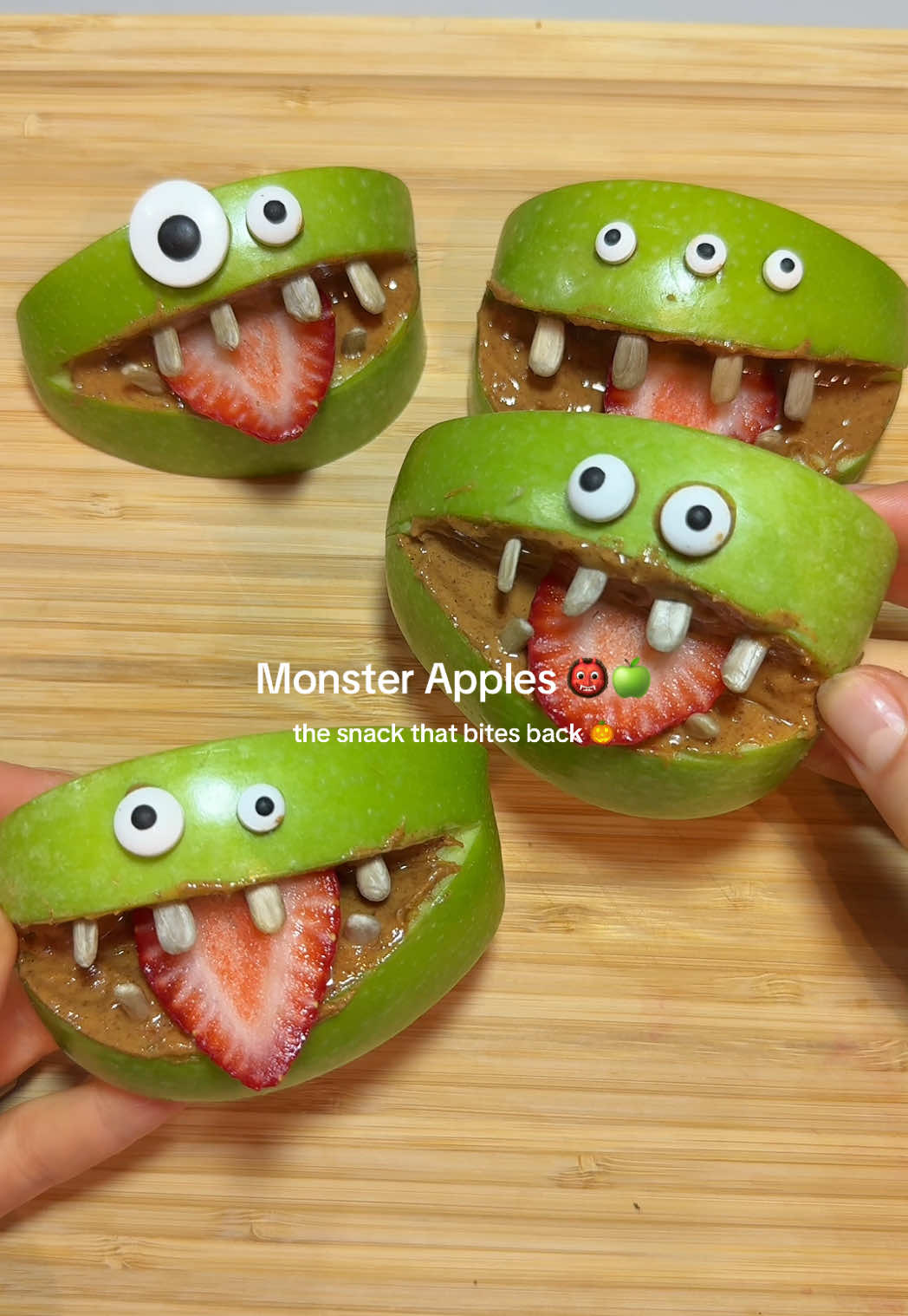 Snack Attack 👹🍏 Monster Apples that bite back! 🎃 The cutest (and easiest) Halloween snack. Ingredients: Green apples Peanut butter (or almond butter) Strawberries (for tongues) Sunflower seeds (for teeth) Candy eyes Method: 1️⃣ Slice apples into quarters and cut a small wedge for the mouth 2️⃣ Spread peanut butter inside 3️⃣ Add strawberry slice for a tongue 4️⃣ Press in sunflower seeds for teeth 5️⃣ Stick on candy eyes with peanut butter #halloweenfood #funfood #EasyRecipe #healthyrecipes #tiktokfood 