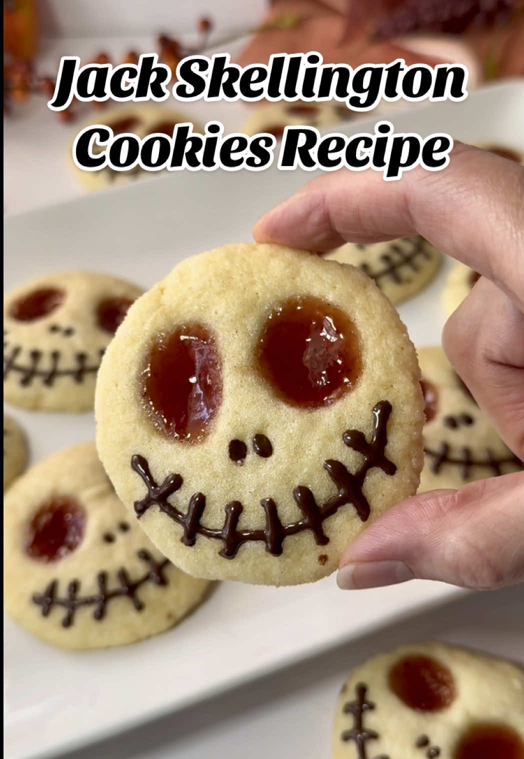 Make Halloween a real treat with these fun skeleton thumbprint cookies! Easy Jack Skellington Cookies Recipe - Ingredients: 1/2 cup butter, softened 1/2 cup sugar 1 egg 1 tsp vanilla extract 1 1/2 cups allpurpose flour 1 tsp baking powder Pinch salt 1/4 cup jam Preheat the oven to 350°F, line cookie sheet with parchment paper Cream together butter and sugar Add egg and vanilla Mix until blended Slowly mix in flour, baking powder and salt Scoop dough into balls and roll in sugar Place on prepared pans and flatten each cookie slightly Make an indentation for eyes and fill with 1/4 tsp of jam Bake 10-12 min Cool slightly and move to cooling rack to cool completely Melt chocolate and coconut oil in microwave in 15 second increments Place melted chocolate in piping bag and decorate cookies Enjoy! 💋 . . . #halloween #HalloweenTreats #spookytreats #EasyRecipes #creatorsearchinsights 