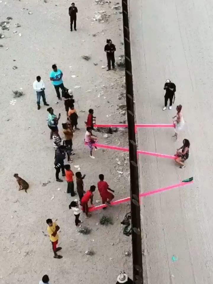 A collection of bright pink seesaws that allowed people to interact over the US-Mexico border has won the prestigious Design of the Year award, with its creators saying they hoped the work encourages people to build bridges between communities. The Teeter Totter Wall, which bridged across El Paso in Texas and Ciudad Juárez in Mexico during a 40-minute session, was described as not only feeling ‘symbolically important’ but also highlighting ‘the possibility of things.’ - text via @guardian Installation: “Teeter Totter Wall” by Ronald Rael (@rrael) and Virginia San Fratello (@vasfsf)