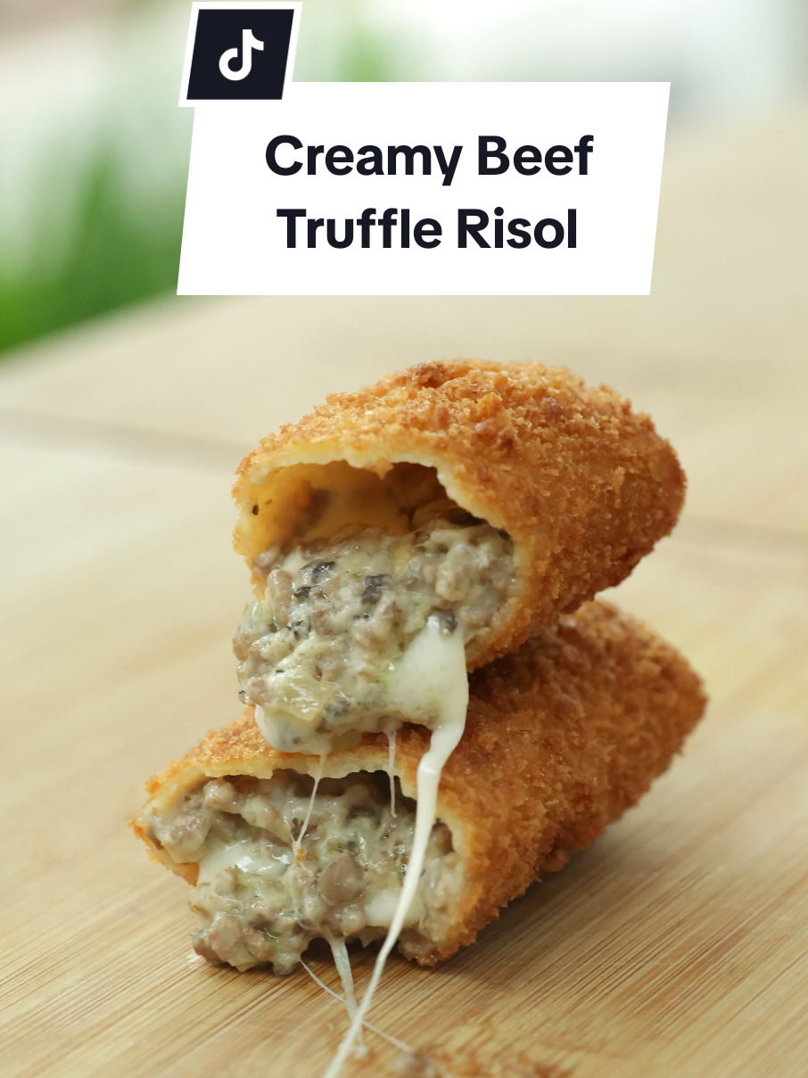 Resep Creamy Beef Truffle Risol (untuk 10 porsi) Bahan kulit: 180 gr tepung terigu protein sedang 2 sdm maizena 300 ml air 100 ml susu 1 sdt garam 1 butir telur 1 sdm butter blend margarine, lelehkan Bahan roux: 35 gr butter blend margarine 3 sdm tepung terigu protein sedang Bahan isian creamy beef truffle: 25 gr butter blend margarine 75 gr bawang bombai 3 siung bawang putih 275 gr daging sapi giling 120 gr jamur kancing putih ½ sdt thyme kering (opsional) ½ sdm mustard (opsional) 150 ml air 300 ml susu ½ sdt garam 1 sdt kaldu ayam bubuk 1 sdt gula pasir ¼ sdt merica ½ sdm truffle oil Bahan saus truffle: ¼ buah bawang bombai, potong 2 siung bawang putih 80 gr jamur kancing putih, potong 2 sdm butter blend margarine ¼ sdt thyme kering (opsional) 1 lembar bay leaf (opsional) 1 ½ sdm tepung terigu protein sedang 300 ml susu 100 ml cream ½ sdt garam ¼ sdt kaldu jamur ½ sdt gula pasir 1 ½ sdm truffle oil Bahan lainnya: mozzarella Bahan pelapis basah: 75 gr tepung terigu protein sedang 1 butir telur 120 ml air Bahan pelapis kering: tepung roti putih Cara membuat: 1. Untuk isian, cincang bawang bombai dan jamur kancing putih 2. Untuk roux, panaskan butter blend margarine dan tepung terigu, masak hingga wangi, sisihkan 3. Panaskan butter blend margarine, masukkan bawang bombai dan bawang putih cincang, masak hingga wangi 4. Masukkan daging sapi giling, masak di api besar hingga wangi kemudian masukkan jamur, thyme, mustard, garam, kaldu ayam bubuk, gula pasir dan merica, masak sesaat 5. Masukkan air, masak hingga menyusut lalu masukkan susu dan roux, masak hingga menyusut. Matikan api dan masukkan truffle oil, aduk rata. Dinginkan 6. Di dalam mangkuk, masukkan tepung terigu, maizena, garam, telur, susu dan air secara perlahan sambil diaduk kemudian masukkan butter blend margarine yang sudah dilelehkan, aduk rata dan saring 7. Panaskan wajan terbalik kemudian celupkan beberapa detik ke dalam adonan, masak beberapa saat dan lepaskan dari cetakan 8. Siapkan kulit risol, letakkan isian, ratakan sedikit dan letakkan keju mozzarella, gulung perlahan 9. Di dalam mangkuk, masukkan tepung terigu, telur dan air secara perlahan, aduk rata 10. Celupkan risol ke dalam tepung basah lalu tepung roti 11. Panaskan minyak, goreng risol hingga sedikit kecokelatan, tiriskan 12. Untuk saus, masukkan bawang bombai, bawang putih dan jamur ke dalam food chopper, haluskan 13. Panaskan butter blend margarine, masukkan jamur, bay leaf dan thyme kering, tumis hingga wangi kemudian masukkan tepung terigu, masak sesaat 14. Masukkan susu sambil diaduk, cream, garam, gula pasir dan kaldu jamur, masak sesaat. Matikan api dan masukkan truffle oil, aduk rata 15. Creamy beef truffle risol siap disajikan