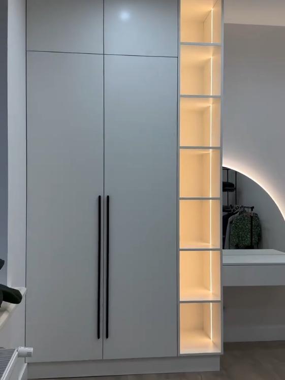 Elegance meets functionality ✨ Minimalist wardrobe with modern lighting touch #ModernWardrobe #LuxuryInterior #HomeGoals #LEDDesign #MinimalStyle