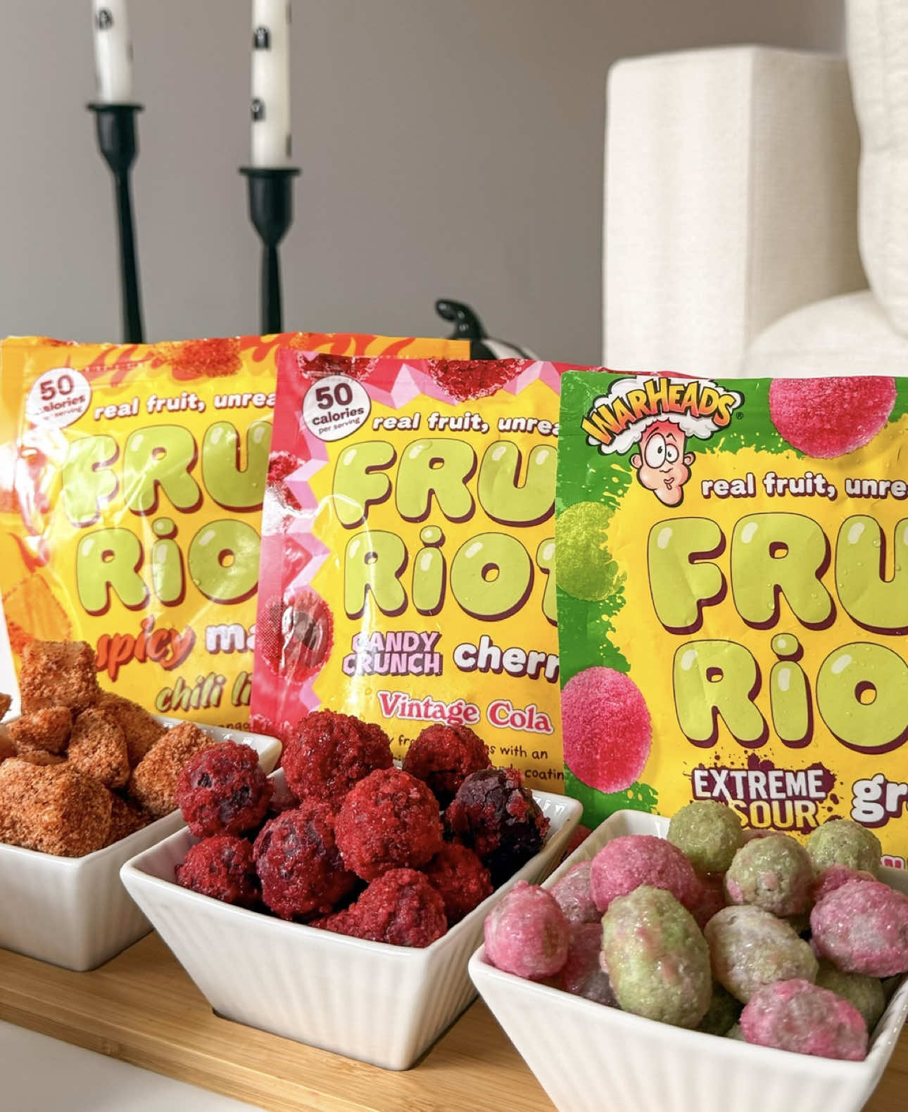 Spooky movie nights hit different with the right snacks 🎃👻🍬 I set up the coziest Halloween night-in with popcorn, blankets, and @Fruit Riot which is frozen fruit with the most addictive candy-like coating. Their flavors are next level: 🍉 Watermelon Blast, 🥤 Vintage Cola, and 🌶️ Chili Lime. Perfect for sharing with your bestie while watching scary movies. Who’s your go-to movie night bestie? Tag them below 🍿🖤 Ad #halloweensnacks #halloweenideas #halloween2025 #fruitriot #spookyseason