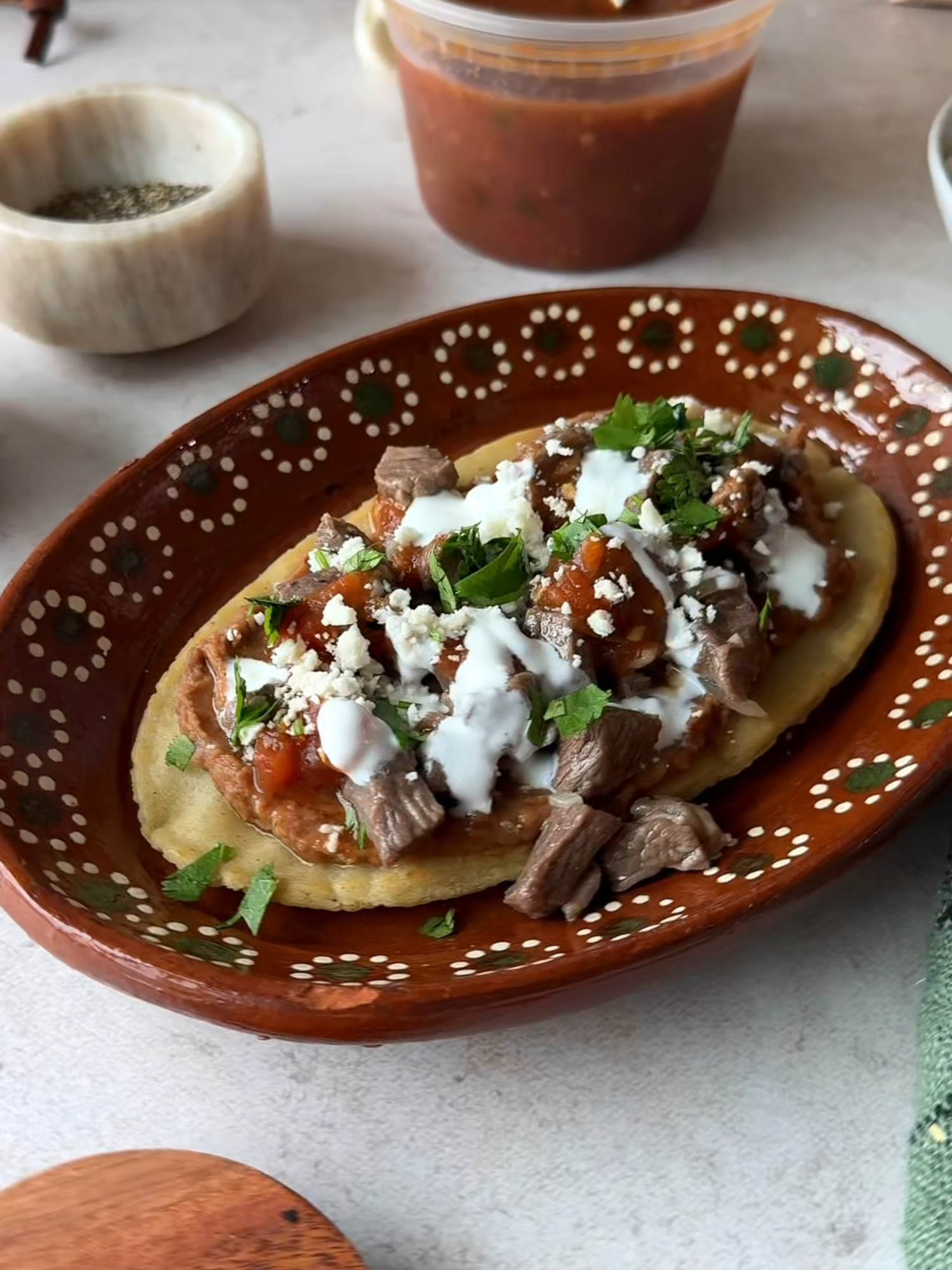 Masa is at the heart of so many Mexican dishes I grew up with. Tortillas, sopes, gorditas… and now these huaraches. These oblong-shaped huaraches are topped with refried beans, juicy steak, salsa, avocado, and cheese. Simple ingredients, big flavor, and ready in under an hour. 📌 And save and share it so you can watch it again when you make it! The recipe is linked in my @isabeleatsblogprofile or search for https://www.isabeleats.com/mexican-huaraches/ #mexicanrecipe #mexicanfood #huaraches #authenticmexicanfood
