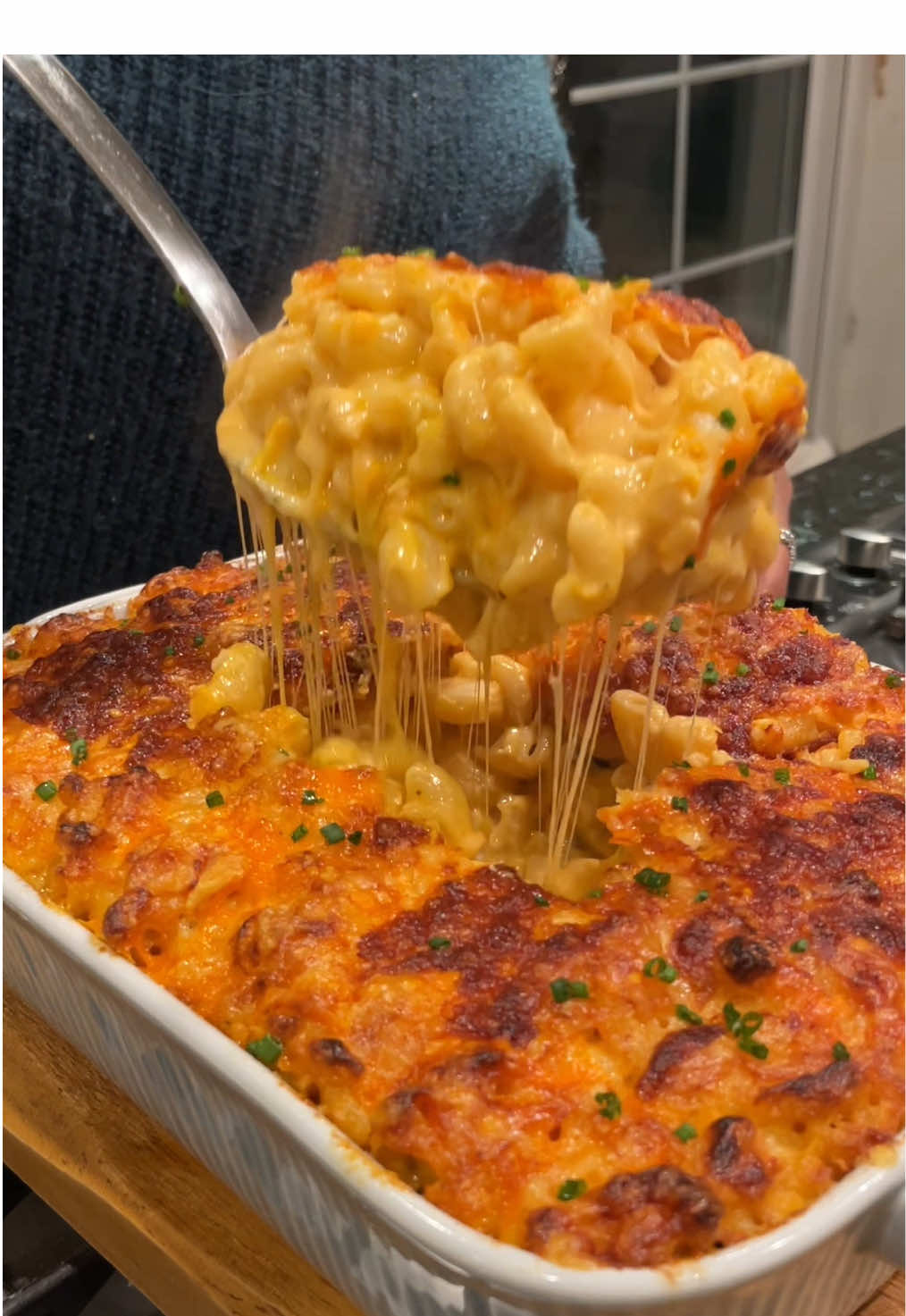 MAC & CHEESE!  Sorry but this is the best Mac & cheese you will have. FULL RECIPE VIDEO ON IG!  Serves 5-6 portions  500g macaroni  200g cheddar  200g Gruyère 200g red Leicester  150g mozzarella  (Save 50g-70g of cheese to add ontop of the bake before cooking)  2 shallots  3-4 garlic cloves  1 tbsp cream cheese  60g butter  40g flour  500ml milk (room temperature) 150ml double cream (room temperature)  Heaped tsp paprika Heaped tsp garlic powder  Sprinkle of cayenne pepper  1/2 tsp Dijon mustard  Salt & pepper to taste  In a pan melt down your butter and sauté shallots and garlic. Add in spices and let them bloom/cook for 2 mins  Add in your flour and whisk until it’s a paste. Turn heat to low. Add in your milk and continue to whisk until there are no lumps. You want to keep whisking until it thickens slightly, be careful as this can happen very fast, if it’s too thick, add more milk  Whisk in Dijon and your cream. And then add in your cream cheese. Season and taste at this point. Go in with your cheeses but remember to leave some aside to add to the middle/top (maybe 50-70g)  Whisk in and then add your cooked macaroni and stir until combined. Now add half into your baking dish and top with a sprinkle of cheese. Add the rest and top with more cheese. Bake for 15mins and then grill until bubbly and golden. Serve with chives on top  #macandcheese #macaroni #macandcheeselove #cheesypasta #macaronirecipe 