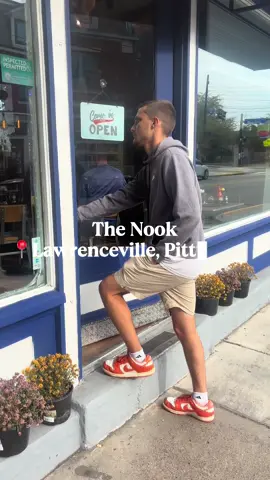 Let me take you to one of my FAVORITE breakfast spots located right in Lawrenceville! The nook is easily my go to when it comes to getting breakfast. The staff is so friendly and knowledgeable, the food ALWAYS hits, and the hand made coffees and cocktails elevate the experience to another level!  Appetizer: Battered Corn Elote Balls with a house made Spicy Sauce (These were so soft and the perfect amount of spice) Main Courses: (Their new special!) Pumpkin Pancakes, Two fluffy pancakes topped with peaches, cinnamon, powdered sugar with a side of whipped cream and a house made maple butter drizzled over top  Waffle Benedict  A fluffy Belgian waffle topped w 2 poached eggs, cheddar cheese, Canadian bacon and finished off with a house made hollandaise sauce, we got ours with a side salad topped with their house dressing  Drinks:  Hot Chai Tea Latte  Hot Mocha #fypシ #pgh #viral #thenook #breakfast 