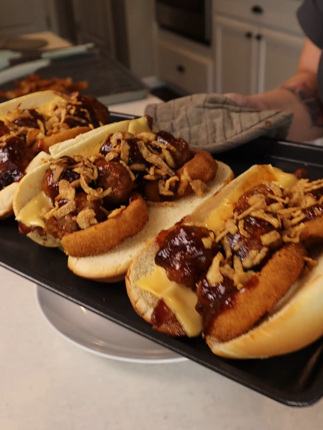 Bacon BBQ Meatball Subs-Day 4 of cooking through my freezer in October! Tonight I pulled out some meatballs, bacon, and a half-empty bag of onion rings. At first, I thought about just making simple meatball subs… but then I thought: if it can go on a burger, surely it can go on a meatball sub, right? #FreezerChallenge #CookWhatYouHave #FreezerCleanOut #OctoberGoals #BudgetFriendlyMeals #MeatballSubs #CreativeCooking