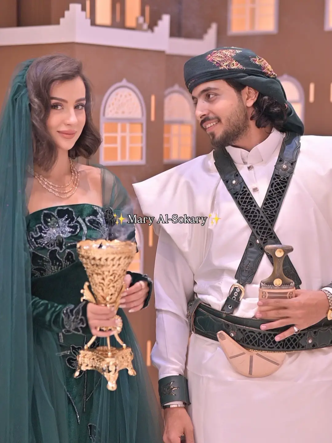 اشرح الصورة بكلمة من وجهة نظرك ✨❤️ Dress designed and photography is done by me بعض تفاصيل تصويري للجميلة  @manalnadem  The photos capture a photoshoot of a bride and groom, or a couple, in luxurious traditional attire with a heritage atmosphere (traditional architecture, incense, and embroidered outfits). The focus is on showcasing the embroidered green traditional outfit and folkloric touches such as the incense burner and the jambiya (traditional dagger).الفستان من تصميمي للعرايس يوم الحناء @mary_alsokary_london الديكور من @muluk_alsaeedah #تصوير #تصوير_عرسان  #coplesphotography #copleshoot #تصوير_عرسان_يمنيين   