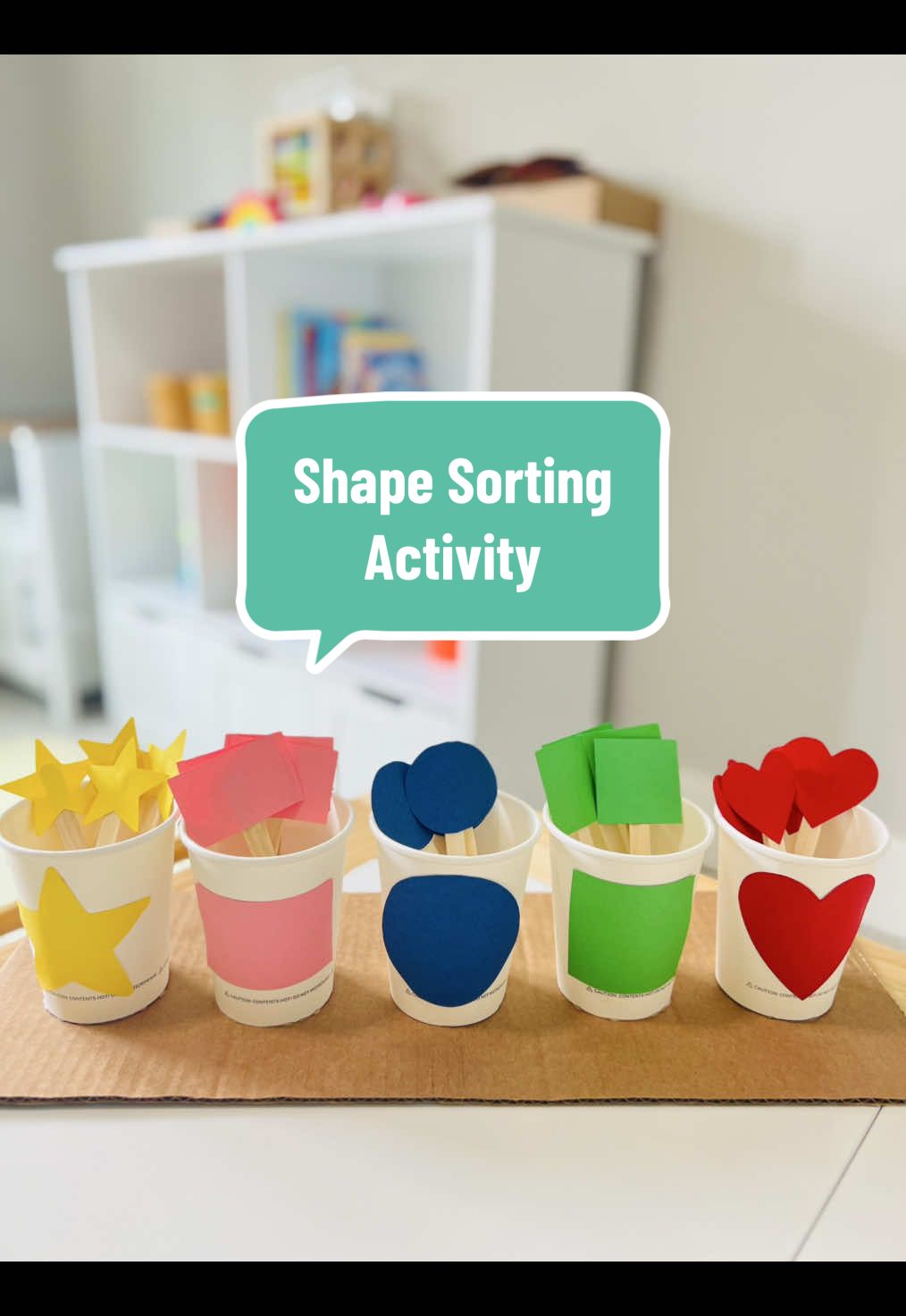 Want a fun way to teach shapes?🔴🔺🟩 Try this DIY shape sorting activity using cups, colored papers and popsicle sticks. Give it a go and see how much they'll enjoy it! 🤩😍#montessoriactivities #diyactivitiesforkids #learningthroughplay #shapesorting #ToddlerActivities   