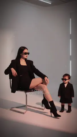Ngầu căng đét luôn chứ phải đùa            B1 : Vào Gemini  B2 : Tải ảnh 2 mẹ con riêng biệt và rõ nét  B3 : Nhập câu lệnh : Create an image from the orginal photo. taken in a studio. Do not change the face Make it as detailed and similar as possible to one of the photos. Shows a beautiful and independent young woman sittting casually on a metal chair with her legs crossed Wearing a blach blazer. Black skirt and boots with an elegant impression. Sunglasses that match the pose of the face. and the little girl: wearning a black blazer. Black and boots and wearning sunglasses. Soft and minimal lighting evokes a steady shadow and fiery atmosphere. Slightly relaxed body posture with one hand on the back of the chair facing the side. That background. Bright, beautiful, simple and modern. Overall gives a feeling of elegance. Cool, mysterious. Minimal clean style, but still aggressive and elegant. #gemini #xuhuong #ghepanh #trungthu2025 