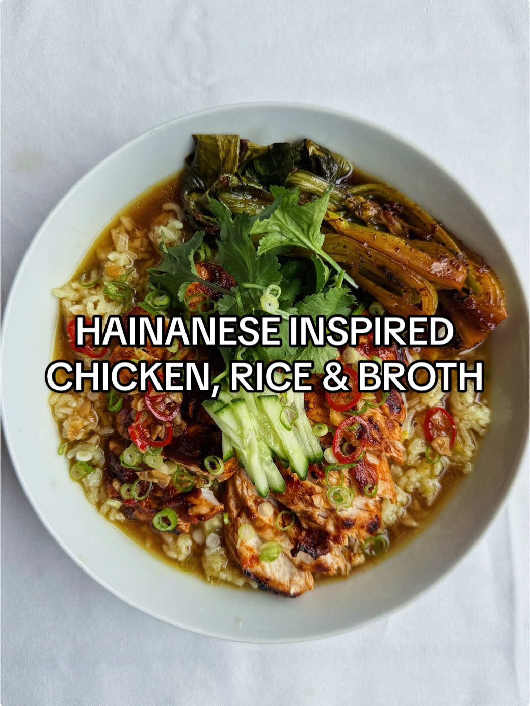 HAINANESE INSPIRED CHICKEN RICE AND BROTH  Serves 1  chicken  - 1 chicken breast, cut into two  - 2 Birds Eye chillies, finely chopped (deseeded if you want) - 5cm piece of ginger, grated  - 2 garlic cloves, minced - 1 tbsp siracha  - 1 tsp white sugar  - 1 tsp rice wine vinegar  - 1 tsp Sesame oil  - 1 tbsp chicken stock  - Splash of neutral oil for frying  Rice  - 5cm piece of ginger, grated  - 2 spring onions, white part, finely chopped  - 1 cup washed jasmine rice  - 1.5 cup chicken stock  - Neutral oil  Broth  - 2 cups chicken both  - 2 tbsp soy sauce  - 2 spring onion, green parts only  - 1 tbsp Sesame oil  Lime chilli sauce  - 2 garlic cloves, finely chopped  - 1 Birds Eye chilli, finely chopped  - 1/4 cup neutral oil  - 1.5 tbsp soy sauce  - 1 tsp sesame oil  - Juice of 1 lime  To serve  - 1 bok choy , cooked in the left over chicken stock  - 1 spring onion  - 1 cucumber  Method  - Start with the broth, add all the ingredients to a pot, simmer with the lid on.  - For the rice, saute the ginger and spring onion in the neutral oil for 1-2 min before adding in the washed rice & sesame oil. Give a mix then add in the chicken stock. Cook using the absorption method until it’s nice and fluffy.  - For the chicken, mix together all the ingredients except the chicken breast. Coat the chicken in the marinade.  - Fry both sides of the chicken in neutral oil until charred on medium heat. Add in the left over sauce once chicken is cooked. Cook for a further 1 min. Remove from the pan & cook the bok choy plus the remaining chicken stock in it.  - For the chilli lime sauce, heat the neutral oil and carefully pour over the garlic and chilli. Add in the sesame oil, soy sauce & lime juice. Mix.  - Assemble. Place rice on the bottom, pour in the broth, chicken & bok choy on top, garnish with spring onions & cucumber. Spoon over the chilli lime sauce. Enjoy! #chicken #rice #broth #hainanesechickenrice #comfortfood 