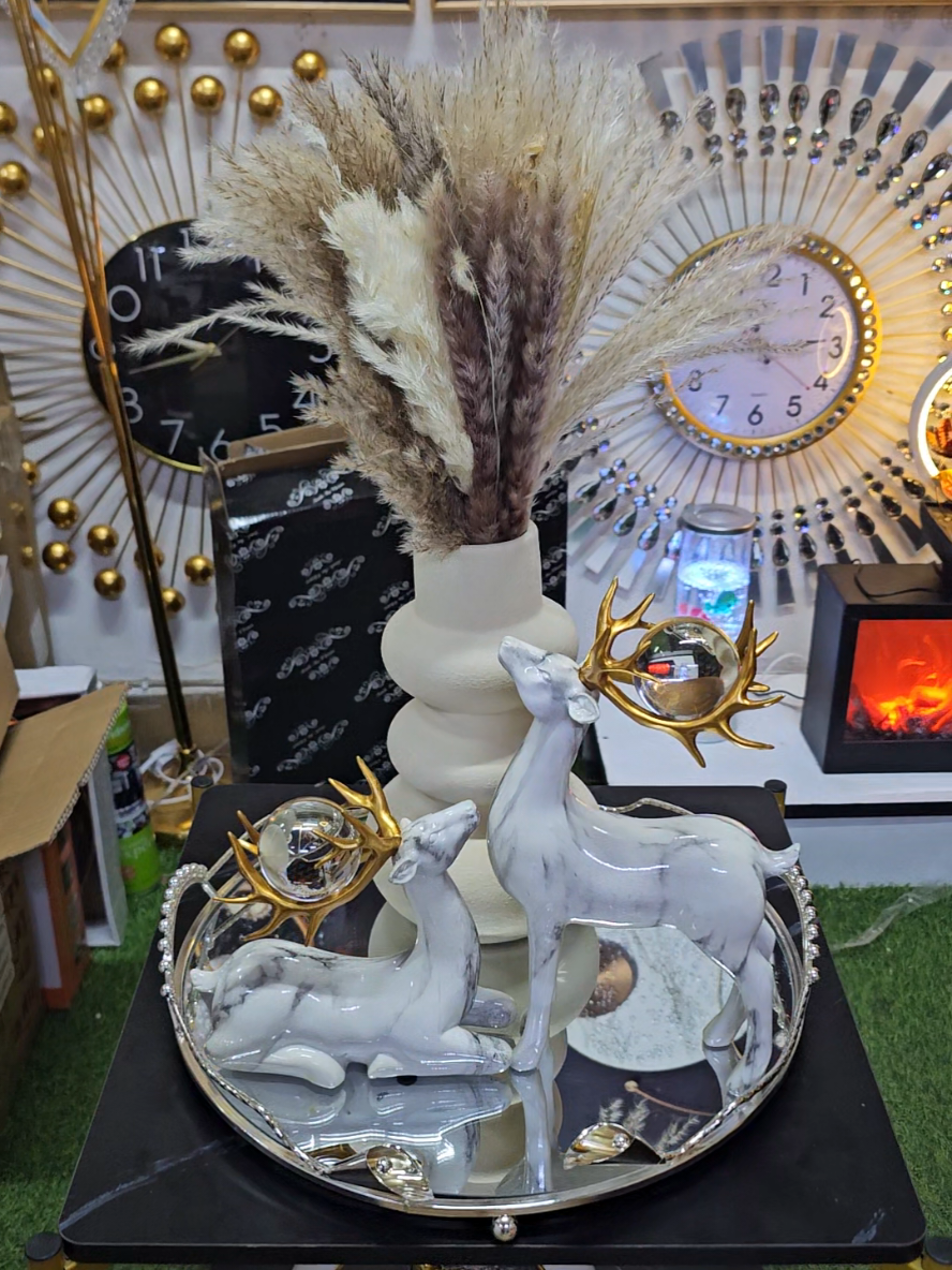 Unique decor Tray,deers and flower vase with flowers available  visit us Along Accra Road, Accra Trade Centre Building 4th floor shop Ff6. 