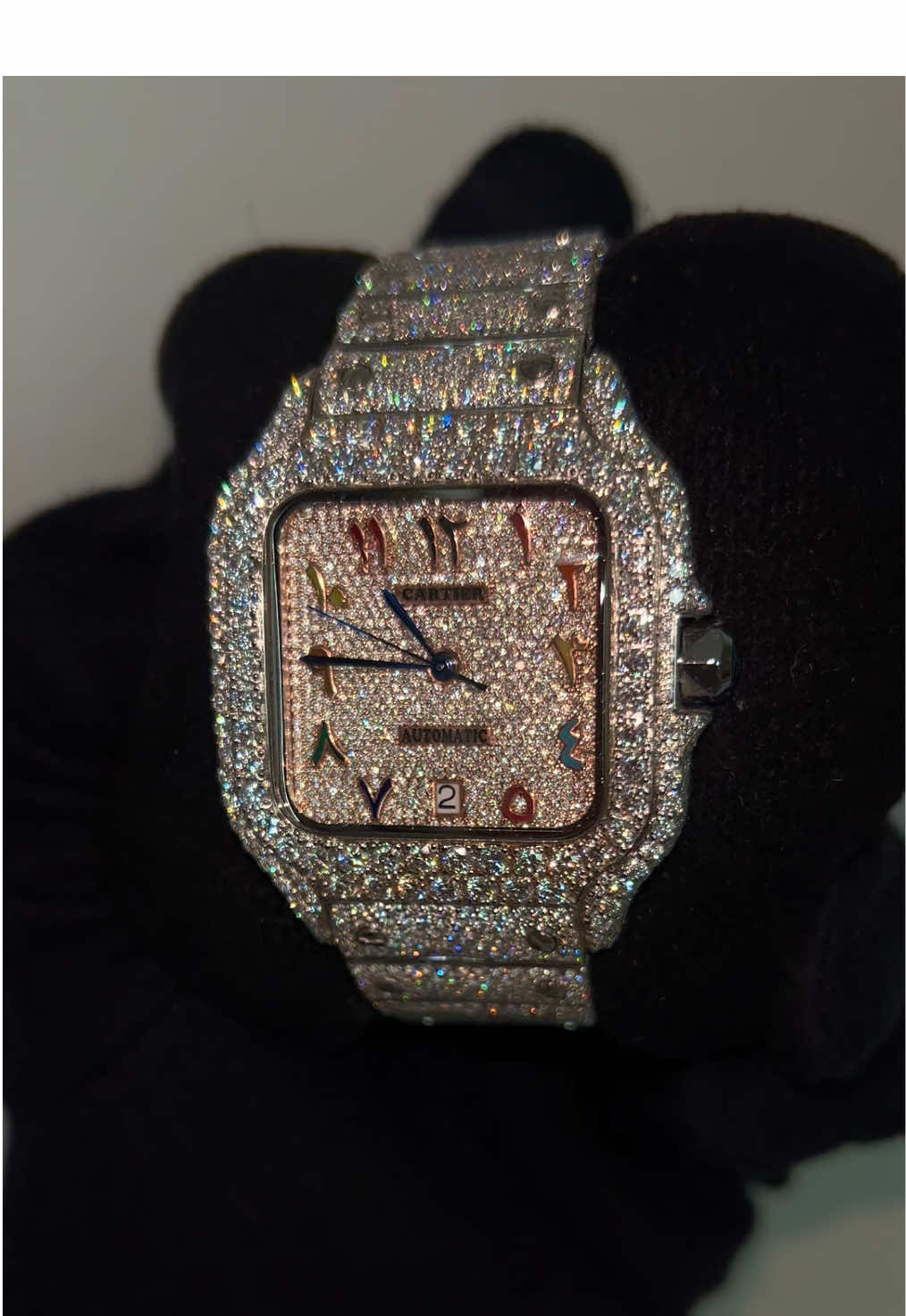 Fully Custom Cartier 🔥 • Custom rainbow Arabic dial 🌈 • Rose gold face 💎 • Fully iced-out design Built for a client — and yours can be next. DM @miaflooded on Instagram to begin your custom piece today. #Moissanite #IcedOut #BustDown #VVS #MIAFlooded 