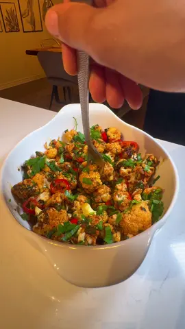 ✨Spicy Cauliflower with Coriander and Garlic  Ingredients: 	•	½ kg cauliflower  	•	6 garlic cloves 	•	1 cup fresh coriander (cilantro) 	•	1 tablespoon sweet red pepper paste  	•	½ cup olive oil 	•	1 teaspoon each of: salt, black pepper, paprika, and ground coriander ( you can also replace the coriander by cumin) 
