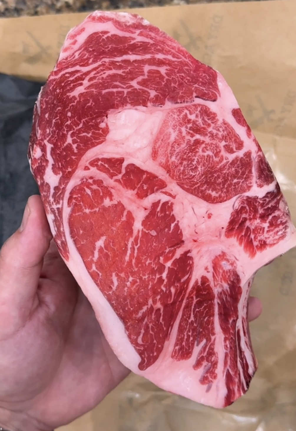 🔪🥩🔥 Prime 60 Day Dry Aged Ribsteak Easily one of my all time favourite steaks - nice marbling, thick cap, perfect age, and a bone to gnaw on. STEAK Steak rubbed in kosher salt, on to a wire rack and in to the fridge uncovered for 6 hours. Greased the grill with the fat cap, then a hard sear on both side. Once nicely seared moved to indirect up and away but the coals below to drip on for some smoke. Standing on the bone to protect the meat, and some foil to protect the cap while still getting gentle heat. Coals were dying, so threw a rack right on them for a final blast of heat before slicing and serving. 🥩 Prime 60 Day Dry Aged Ribsteak @dryagedmarket  🔥 Charcoal & Parrilla @Charcoal Chariots  . . . #Steak #BBQ #Grilling #DryAged #Ribeye 