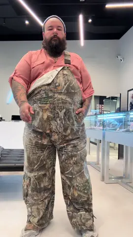 Top to bottom: Supreme periwinkle beanie  @Torrid salmon chiffon top Berne @Realtree Outdoors overalls @New Balance 9060s @Ali Weiss Jewelry chain