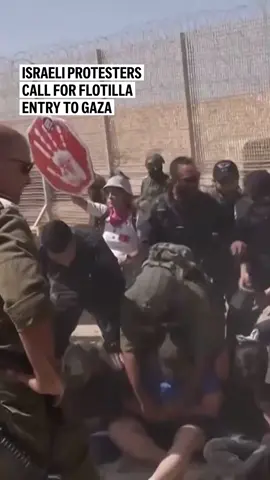 Israeli protesters blocked troops en route to Gaza on Friday, calling on the Israeli government to allow the flotilla into the enclave. Soldiers and police forcibly removed them, clearing the way for troops and military vehicles to pass.