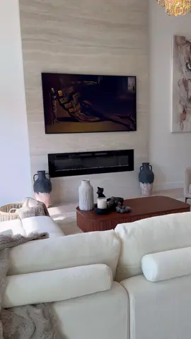 Do you agree your living room is the second most used space in the home?  For this project I didn’t want to take away from the expansiveness of the living room. My clients wanted a sectional to anchor the space so we found something that was both functional and stylish. From the multiple layered chandelier echoing the geometry of the room to low profile ribbed coffee table, each of these elements keeps the space polished yet still inviting.  Need help with your space? Send me a DM.  #livingroom #livingroomdesign #livingroomfurniture #homestyle #interiors 