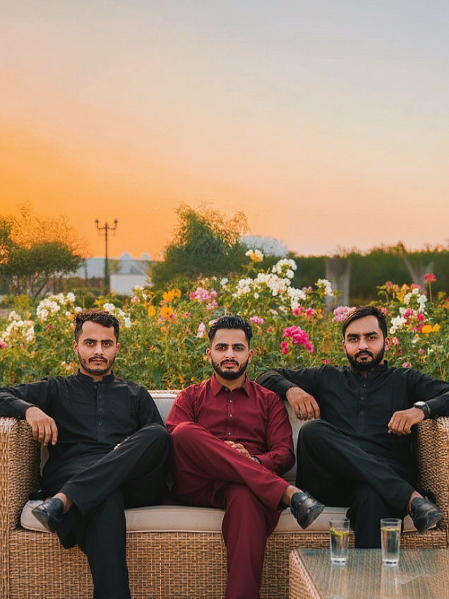#EDITED With Brothers @Tayyab @Zohaib Mughal  #GeminiAI #chatgpt A hyper-realistic 4K DSLR photograph of the uploaded 3 persons, with both exact facial structure fully preserved. A distinguished 1st person 22years old reclines and second person 19years old and third 25 reclines confidently on a wicker sofa in a stylish open garden-side patio. Boths are wears a traditional Pakistani kurta pajama , and he is wearing a (same as photo)exuding elegance and cultural sophistication. The scene is framed by lush greenery, with softly blurred flowering plants in the background creating depth and a serene upscale resort ambiance. Don't face change. Incorporate the name. #trending #foryou 