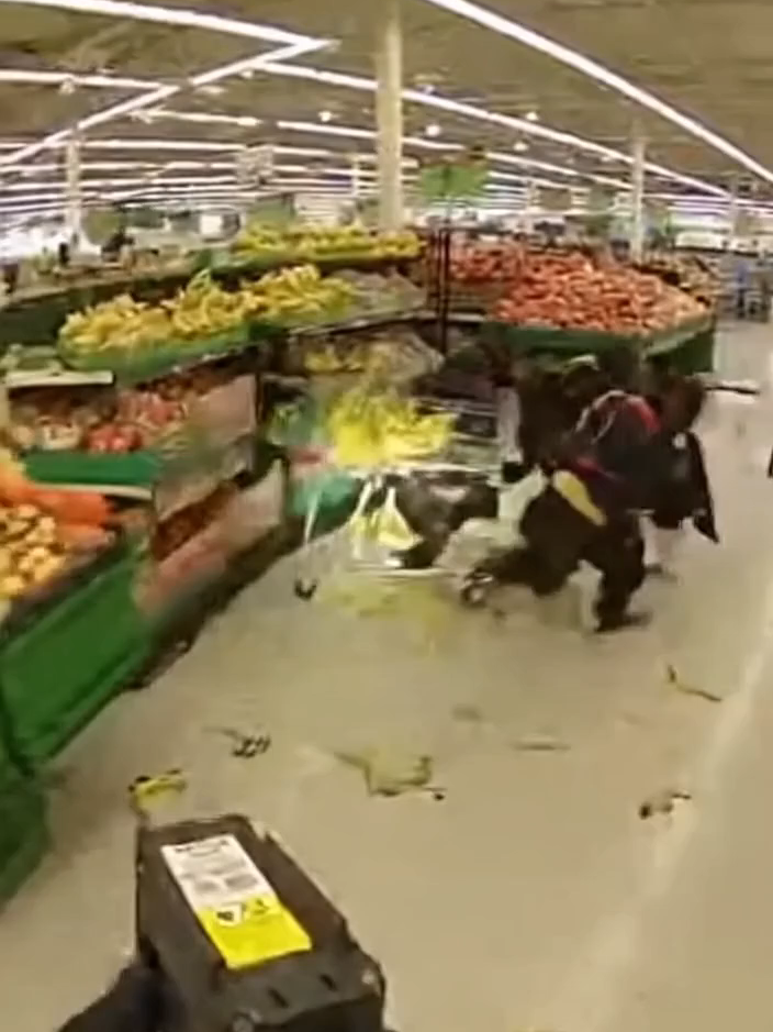 a police cam pov of a cop finding and then chasing a group of chimpanzees through a grocery store for stealing a whole cart of bananas #sora #ai
