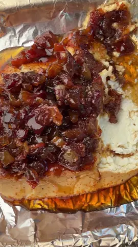 Smoked Cream Cheese with Bacon Jam This is super easy to make! Recipe • Score the cream cheese in a cross hatch then season with a BBQ rub • Smoke the cream cheese for 1 hour • Assemble the bacon jam by frying up 1/2 lb of bacon until crispy then remove. • Cook a diced onion in 2 tbsp of bacon grease until softened.  • Add the bacon back in with 1/4 cup brown sugar, 1/4 cup apple cider vinegar, 1/2 cup of Maple Syrup and 4oz Bourbon  • Cook until thickens then remove from heat. • Remove the cream cheese, then top with the vacant jam and more maple syrup, then serve with crackers . . #cooking #delicious #bbq #Foodie 
