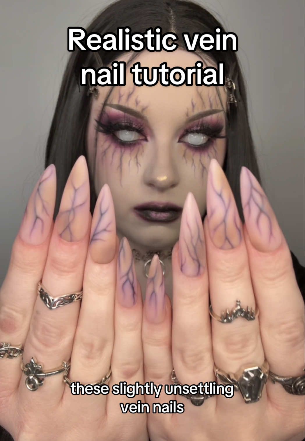 Here’s how I made the vein nails from my last post! They are weird and I hope you like them! . . Products used- @dndgel tea time (sheer nude) and inky point (dark purple) @SHOP NAILZ BY DEV wicked (purple) jelly polish, and blood bath (red) jelly polish  @vettsystore frozen jelly polish @Blend Bunny Cosmetics Ellis Atlantis palette (that I use specifically for nails only) @BeetlesGelPolish matte top coat . . . #halloweennails #halloweennailart #gothnails #gothicnails #alternativenails #nailarttutorial #nailtutorial #gelnailpolish 