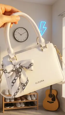 ✨ Elegan dalam kesederhanaan ✨ Tas ELDORA ini memancarkan kesan mewah dan feminin dengan desain minimalis, detail pita yang manis, serta warna putih yang timeless — cocok untuk melengkapi gaya kamu di setiap kesempatan 🤍👜 #outfitwanita #taskondangan #taselegan #tas #tasselempang 
