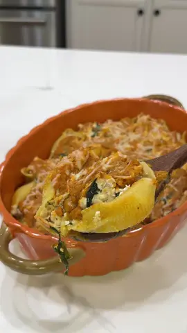 Creamy pumpkin stuffed shells 😍 A fall twist on a classic, so easy and so good! #fallrecipes #cozydinner #bakedpasta #pumpkinseason #easymeals  Ingredients 25 jumbo pasta shells, 1 lb lean ground turkey, 1 tsp minced garlic, 1 tsp dried parsley, 1 tsp Italian seasoning, 1 tsp salt (divided), 1/2 tsp black pepper (divided), 1/2 tsp dried minced onion, 1/4 tsp fennel seed, 1/4 tsp paprika, 1/4 tsp red pepper flakes, 2 cups fresh spinach, 1 cup ricotta cheese, 3/4 cup low-sodium chicken broth, 1/2 cup milk ( I used Fairlife) ,1 and 1/2 cups pure pumpkin purée( i used Libby’s), 1/4 tsp dried marjoram, 1/4 tsp dried sage, 2 oz shredded parmesan cheese (divided) Directions Cook the pasta shells until just tender. Drain, rinse, and let cool while you prep the filling. In a mixing bowl, combine ground turkey, garlic, parsley, Italian seasoning, 3/4 teaspoon salt, 1/4 teaspoon pepper, minced onion, fennel, paprika, and red pepper flakes. Brown the turkey in a skillet over medium heat, breaking it apart as it cooks. Once the turkey is cooked, stir in the spinach and cook until wilted. Remove from heat and mix in the ricotta until creamy and combined. In a small saucepan, heat chicken broth and milk over medium heat. When it starts to bubble, whisk in the pumpkin puree. Lower the heat, add the remaining salt, pepper, marjoram, sage, and half of the parmesan. Stir until the sauce is smooth and creamy. Spread a thin layer of pumpkin sauce on the bottom of your casserole dish. Stuff each shell with the turkey-ricotta mixture and arrange them open-side up. Pour the rest of the pumpkin sauce over the top, making sure everything is coated.Sprinkle with the remaining parmesan. Bake at 350°F for about 30 minutes, until bubbly and lightly golden. Serve warm with extra parmesan or fresh herbs 