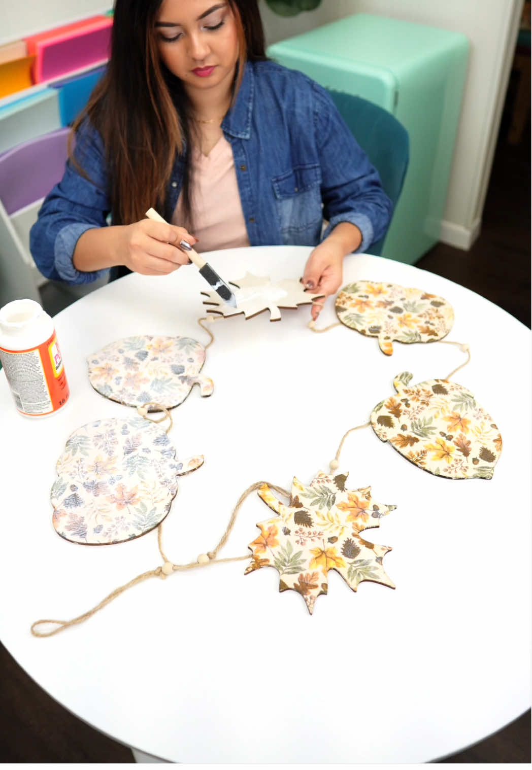 I used the napkin decoupage method with some cute patterned napkins + Mod Podge (it dries clear so the colors pop beautifully!). Such an easy way to make a festive garland for the season! 🧡 • • • #FallDIY #DIYGarland #decoupage #FallCrafts #dollartreediy     