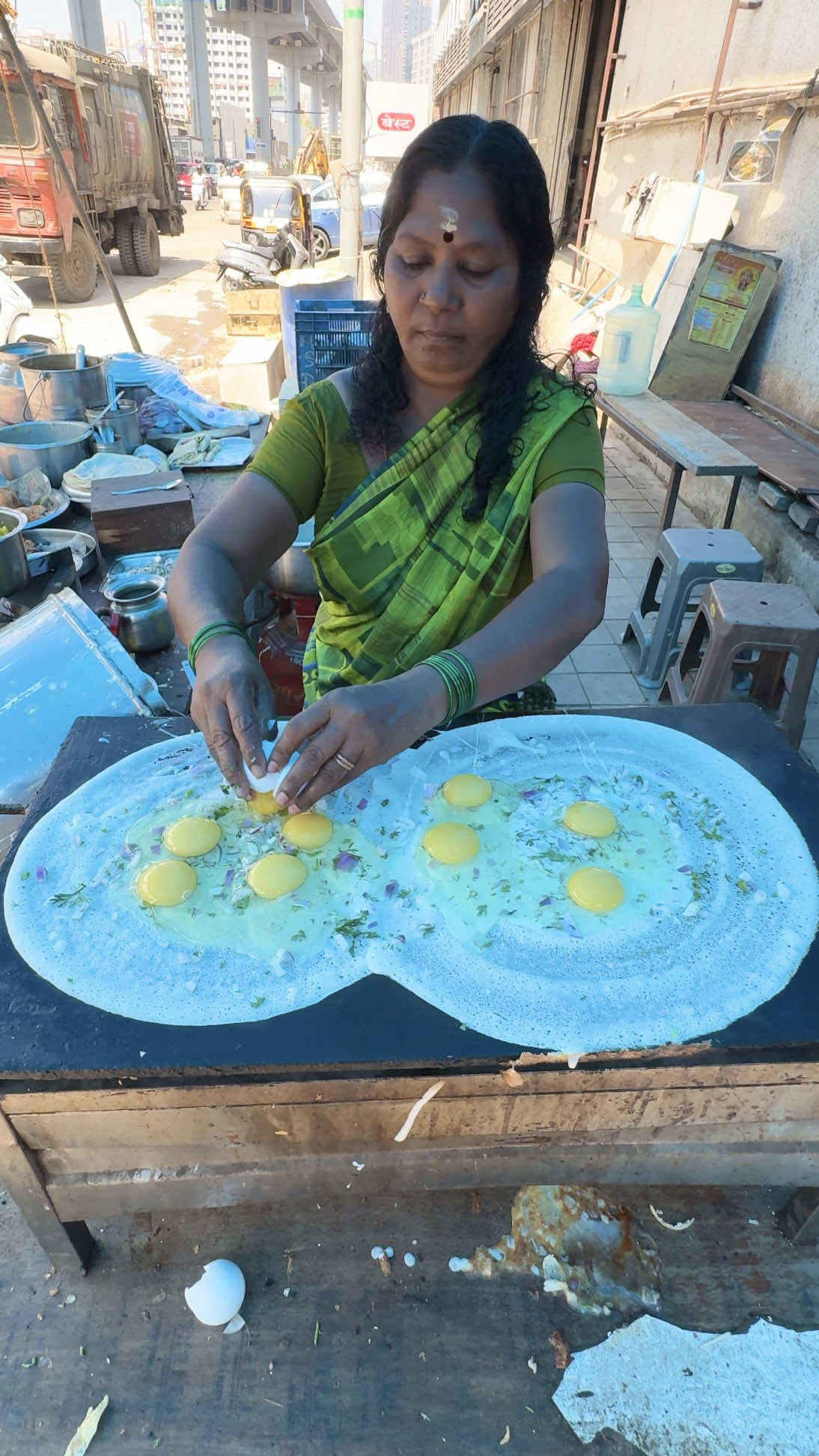 Indian Aunty Makes World's Largest Crepe 🔍 Business name  Dosa 📍Address Mumbai, India  💵 Price 300 Rupee/$ 3.40 USD