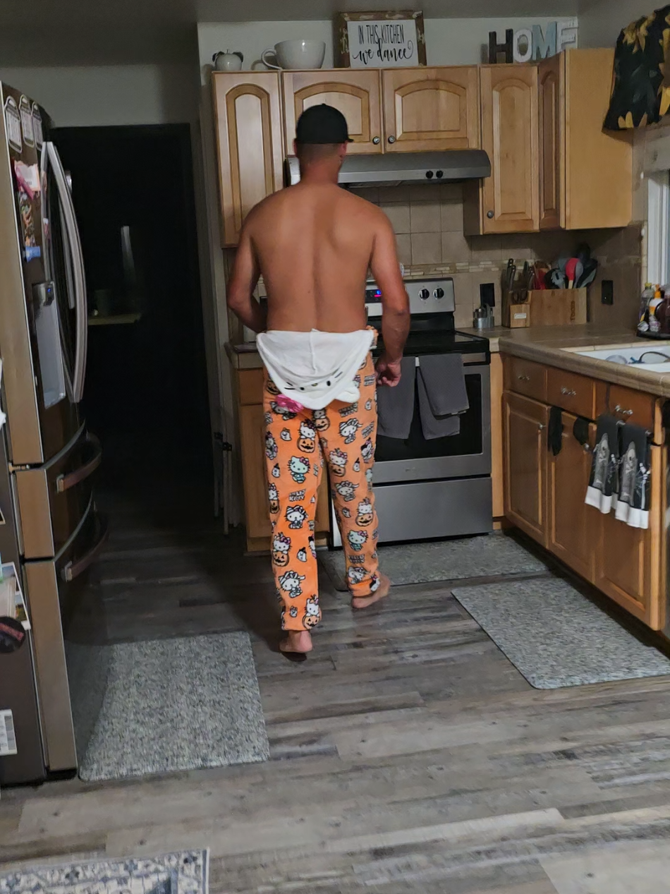 Wearing my Halloween Hello Kitty onsie! Just casually heating me up some chicken and dumplings but throwing his own in the microwave.  Relationship goals!