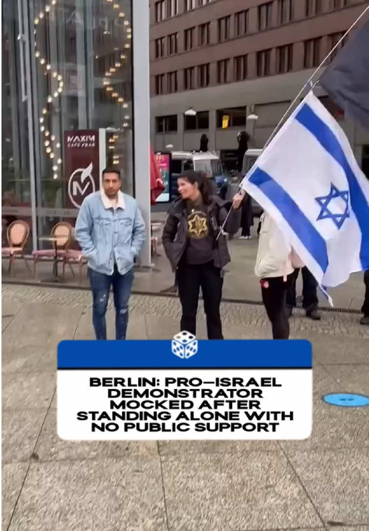 Berlin Pro-Israel Demonstrator Left Isolated and Mocked A woman staging a solo demonstration in support of the Isreali army in Berlin became the subject of ridicule after she was left standing alone with no public backing. Passersby recorded the moment, which quickly spread online, highlighting the lack of visible support for her stance.