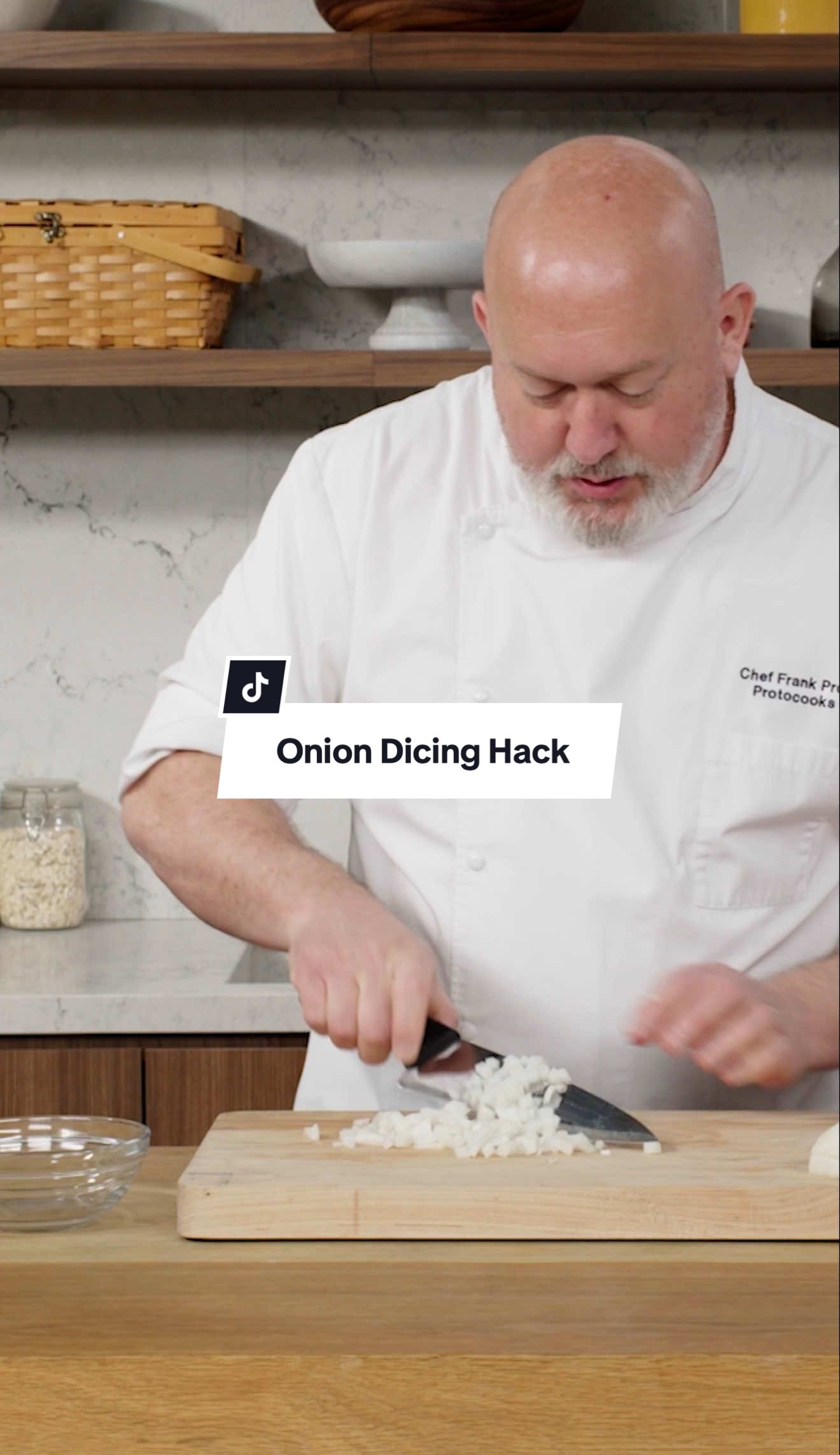 Pro chef and culinary instructor Frank Proto wears by a different dicing method—one not taught in culinary school. #dicedonions #onions #kitchenhack #easycooking 