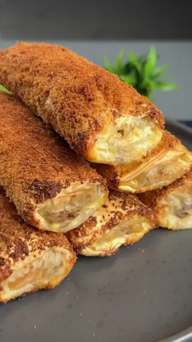 #VNVideoEditor                                        A delicious appetizer with minced meat and cheese.                                        Master Chef Reveals Secret to PERFECT Minced Meat & Cheese Appetizers INGREDIENTS: ●Onion - 1 pcs. ●Vegetable oil - 3 tbsp ●Ground meat - 500 g ●Salt - 1 tsp ●Black pepper - to taste ●Smoked paprika - 1 tsp ●Meat seasoning - 1 tsp ●Filo pastry - 200 g (6 sheets) ●Grated mozzarella cheese - 150 g ●Eggs - 2 pcs. ●Salt - to taste ●Milk - 50 ml ●Breadcrumbs - 6 tbsp 1. Fry finely chopped onion in vegetable oil for 1-2 minutes. 2. Add ground meat to the onion, season with salt and spices. Stir and fry over medium heat until tender, about 15 minutes. 3. Let the ground meat cool slightly. Place a few spoonfuls of the ground meat on a sheet of filo pastry, sprinkle with grated cheese, and wrap as shown in the video. 4. Mix the milk and eggs with a fork and beat until combined. 5. Dip the resulting rolls in the egg mixture and then in the breadcrumbs. 6. Place on a parchment-lined baking sheet. 7. Bake in a preheated oven at 190°C  for 25 minutes. ●It's incredibly delicious and very simple!!!● Bon appetit! The recipe in your language is available in the description, 💖🇺🇦🇵🇱🇩🇪🇺🇸🇫🇰🇪🇸🇵🇹🇮🇹🇷🇴 🇷🇸🇭🇷🇱🇻🇸🇮🇨🇿🇫🇮🇸🇪🇩🇰🇳🇴 🇯🇵 🇬🇷 🇮🇱🇰🇿🇰🇬🇱🇻🇹🇼 🇵🇪 🇦🇷 🇨🇱 🇻🇪 🇹🇭 🇧🇷                     #mincedmeat #cheese #appetizer #simplydeliciousrecipes 