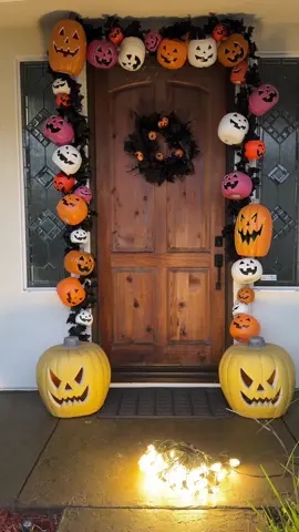 Pumpkin PVC Pipe diy arch using zip ties, pumpkins, pvc pipe, black leaf garland and lights.  #halloween #halloweendecorations 