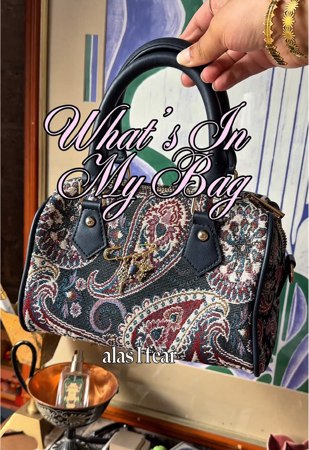 what’s in my bag 👀 ft my beloved bag from @Anthropologie - honestly if this came in a bigger size I’d buy that and be done with it 😂 #bagcharms #kindle #vintagefashion #thrifted #whatsinmybag 