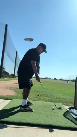 Hitting golf balls at the Good Year Blimp in Carson California