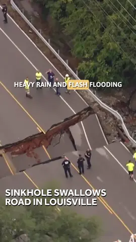 ROAD COLLAPSE | Heavy rain and flash flooding in Louisville led to some major problems. A massive sinkhole opened up across an entire road.