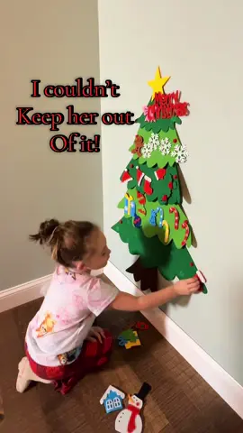 I couldn’t keep her out of it once she saw it - score! #christmastree #kidschristmastree #holidays #kidscrafts #kidsholidaygifts 
