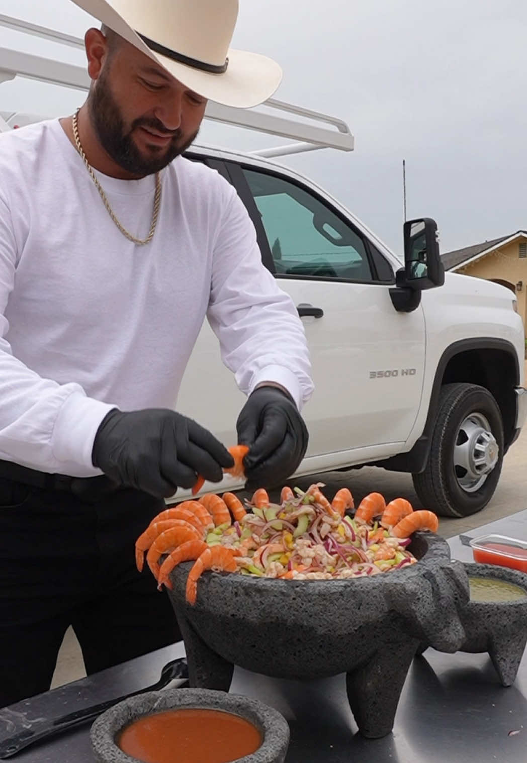 #ad A day in the life of a Hispanic worker. We take pride in who we are and our traditions. On this work day, while my team works on a hard scape project for our customers that want a brand new gate entrance, I made a big molcajete filled with Aguachile for everyone🦐. I teamed up with @Chevrolet I know I can always count on my Chevy Silverado 3500 to take me and my team where we need to go. 👷🏻‍♂️ #Chevy #Silverado #hispanicworkers #aguachile 