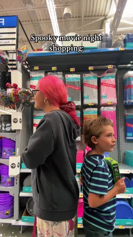 spooky movie night shopping pink hair, lady and son picking things for movie😂 #fyp#parody#funny#boymom#halloween 