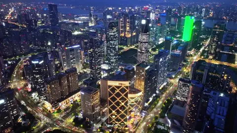 Hangzhou's Night🔥🔥As darkness falls, the city reveals its modern skyline aglow with energy. Discover this breathtaking blend of nature and innovation.  ‼️DM us to plan your perfect Hangzhou night adventure! 🌃✨   #Travel #TravelTips #China #Hangzhou #CityLights