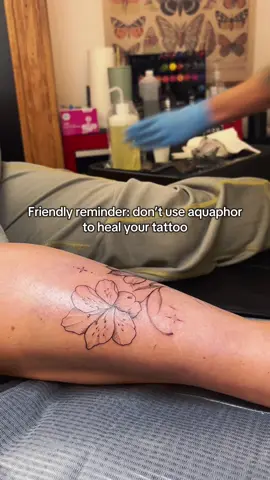 Okay yes this is a little bit of a rage bait post, but there is some truth behind it let me explain! First of all, what is Aquaphor?  Aquaphor is an ointment designed to hydrate and protect your skin, its main ingredient being petroleum. It is often used to hydrate cracked skin, heal wounds, and treat eczema.  “All of this sounds great, why shouldn’t we use Aquaphor to heal our tattoos??” Excellent question! Being a petroleum based product, Aquaphor is a very thick ointment that upon applying, will suffocate your healing tattoo and slows the healing process. Suffocating the tattoo can also lead to trapping bacteria, leading to infections and scarring.  Maybe folks make the mistake of putting far too much on and may experience their tattoo fading much faster than it should.  Truth is, you CAN heal a tattoo just fine with aquaphor, but there are far better and safer options you can use. We currently recommend just a simple plain unscented lotion. Free of artificial colors preferably. You probably already have some unscented lotion in your bathroom now! (And it’s far cheaper than Aquaphor)  We’re not here to judge! I’ve personally healed most of my tattoos with Aquaphor, but I’ve also over moisturized and have had ink be pulled out, so I know from experience it is very possible to go wrong with the petroleum jelly. If you have any questions or yell at us in the comments how you eat Aquaphor for breakfast, please feel free! 😂🫶💚☀️  📍Emerald Sun Studios, Howell Michigan #michigantattooartist #emeraldsunstudios #michigantattooers #howellmichigan #michigan 