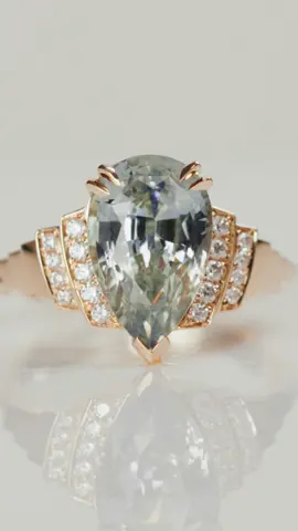 JPX 🤝 Art Deco This beautiful art deco ring seamlessly blends a staircase and our signature Carré twist. The side profile flagships a keystone, an architectural detail symbolizing support, strength, and longevity. At its center lies an heirloom pear cut sapphire, gracefully flanked by diamond pavé. We hope you love it as much as we enjoyed designing it!  #artdeco #customengagementring #customjewelry #sapphire 