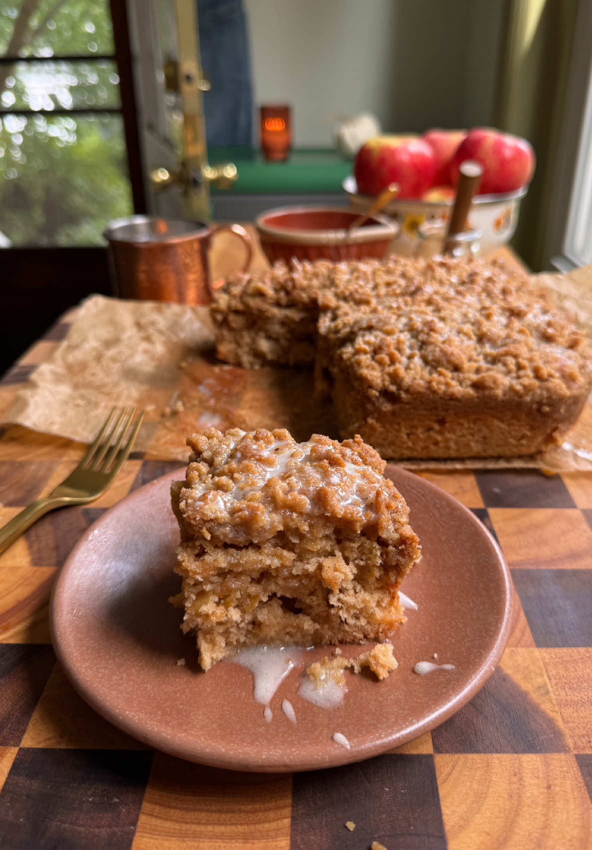 APPLE CIDER DONUT COFFEE CAKE 🍎🧈🤎  The recipe is finally here!! Literally an apple cider donut in coffee cake form 🫨 Except no frying and much easier to make—you guys are going to love this one🥰 Recipe below and on my blog!  Apple Cider Donut Coffee Cake  Cake 3/4 cup of granulated sugar 1/2 cup butter, melted 2 eggs 1 cup apple butter 1/2 cup apple cider  1 tsp vanilla  2 cups of all-purpose flour 2 tsp baking powder 2 tsp cinnamon 1/4 tsp of salt Cinnamon Sugar Crumb Topping  1 cup brown sugar 1 cup all-purpose flour 1/2 cup butter, room temp 1 tsp cinnamon Vanilla Bean Icing  3/4 cup powdered sugar  1 tsp vanilla bean paste  2 tbsp milk  Preheat oven to 350F.  In a small mixing bowl, combine the crumb topping ingredients until you have a crumbly mixture. Set aside.   In a large mixing bowl, cream together the cane sugar, butter, eggs, vanilla, apple butter, and apple cider until smooth. Mix in the flour, baking powder, cinnamon, and salt until a batter forms—be careful not to over mix!  Transfer the batter to a lined & greased 9 x 9 baking dish. Sprinkle the crumb topping evenly on top.  Transfer to the oven and bake for 45-50 mins, or until it passes the toothpick test. Let this cool on a wire rack for 20 minutes.  In the meantime, whisk together the vanilla bean icing. Once the coffee cake has cooled, drizzle it with the icing, slice, and enjoy!