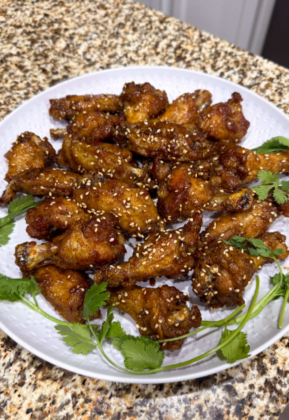 🍗✨ 𝙎𝙐𝙋𝙀𝙍 𝘾𝙍𝙄𝙎𝙋𝙔 𝙎𝙊𝙔 𝙂𝘼𝙍𝙇𝙄𝘾 𝘾𝙃𝙄𝘾𝙆𝙀𝙉 𝙒𝙄𝙉𝙂𝙎 𝗜𝗻𝗴𝗿𝗲𝗱𝗶𝗲𝗻𝘁𝘀: 🔸 2 lbs Chicken Wings 🔸 4 Tbsp Brown Sugar 🔸 3 Tbsp Soy Sauce 🔸 1 Tbsp Water + 1/2 cup Water 🔸 1/2 Tbsp Garlic Powder 🔸 1/2 tsp Onion Powder 🔸 1+ tsp Black Pepper 🔸 3 Tbsp All-purpose Flour 🔸 3 Tbsp Tapioca Starch 🔸 1 Tbsp Unsalted Butter 🔸 Salt 🔸 Cooking Oil 𝗜𝗻𝘀𝘁𝗿𝘂𝗰𝘁𝗶𝗼𝗻𝘀: 1. Lightly season dry Chicken Wings on both sides with Salt and Pepper. Set aside for 15 minutes. 2. In a small bowl, add 4 Tbsp Brown Sugar, 3 Tbsp Soy Sauce, 1 Tbsp Water, 1/2 Tbsp Garlic Powder, 1/2 tsp Onion Powder, and 1 tsp Black Pepper. Mix well. In another small bowl, whisk together 3 Tbsp All-purpose Flour, 3 Tbsp Tapioca Starch, and 1/2 cup Water. Set both bowls aside. 3. After 15 minutes, place the Wings in a large ziplock bag and coat it in the Flour Mixture. 4. Heat oil to 330° F. Fry the Wings until they have browned on both sides. Remove to wire rack. Bring the heat up to 375° F and refry the wings until golden brown. Transfer them back to the wire rack. 5. In a wok, melt 1 Tbsp Unsalted Butter on medium heat. Pour in the sauce and bring it to a boil. Toss in the Wings and turn the heat off. Remove from work and garnish with Sesame Seeds!    #chickenwings #gamedayfood #cooking #EasyRecipe #protein  ___________________________ 𝘓𝘪𝘬𝘦, 𝘊𝘰𝘮𝘮𝘦𝘯𝘵, 𝘚𝘩𝘢𝘳𝘦, 𝘉𝘰𝘰𝘬𝘮𝘢𝘳𝘬 𝘪𝘧 𝘺𝘰𝘶 𝘦𝘯𝘫𝘰𝘺 𝘮𝘺 𝘱𝘰𝘴𝘵 💕